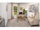 Inviting home office features a bright window, comfortable seating, and stylish decor at 16408 Courlan Rd, Weeki Wachee, FL 34614