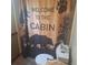 Cabin-themed bathroom featuring a decorative shower curtain and a standard toilet at 5148 Cyril Dr, Dade City, FL 33523