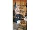 Bathroom features a 'Welcome to the Cabin' shower curtain and nature themed décor at 5148 Cyril Dr, Dade City, FL 33523