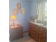 Well-lit bedroom with rustic wooden furniture and a blue-themed decor at 5148 Cyril Dr, Dade City, FL 33523