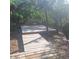 Outdoor deck nestled among mature trees, offering a peaceful retreat at 5148 Cyril Dr, Dade City, FL 33523