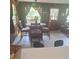 Cozy dining area with views and a wooden table perfect for meals, and tile flooring for simple cleaning at 5148 Cyril Dr, Dade City, FL 33523