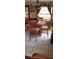 Dining area with a round wooden table and natural light at 5148 Cyril Dr, Dade City, FL 33523