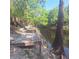 Dock area with stairs, trees, and a river view at 5148 Cyril Dr, Dade City, FL 33523