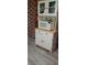 Kitchen featuring white cabinets, a microwave, and wood countertop at 5148 Cyril Dr, Dade City, FL 33523