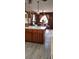 Rustic kitchen with a central island and an open dining area, ideal for Gathering meals at 5148 Cyril Dr, Dade City, FL 33523