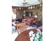 Cozy living room with wooden walls, comfortable seating, and decorative shelves at 5148 Cyril Dr, Dade City, FL 33523