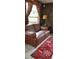 Charming living area features cozy seating and natural light from the window at 5148 Cyril Dr, Dade City, FL 33523