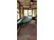 Enclosed porch area with views of the surrounding nature at 5148 Cyril Dr, Dade City, FL 33523