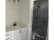 Stylish bathroom with a modern sink, vanity, and glass-enclosed shower at 7677 Deer Valley Circle, Tampa, FL 33635