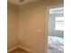 Neutral bedroom showcasing natural light and ample space at 7677 Deer Valley Circle, Tampa, FL 33635