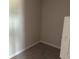 A corner showing a small carpeted room with neutral walls, ready for personalization at 7677 Deer Valley Circle, Tampa, FL 33635
