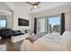 Spacious primary suite with modern fireplace, balcony access, and cityscape views at 1209 E Cumberland Ave # 2101, Tampa, FL 33602