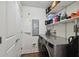 Laundry room featuring full size washer and dryer and built-in shelving at 1209 E Cumberland Ave # 2101, Tampa, FL 33602