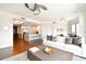 Open-concept living room flows into the kitchen, featuring hardwood floors, modern decor, and ample natural light at 1209 E Cumberland Ave # 2101, Tampa, FL 33602