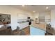 Bright kitchen featuring white cabinets, granite countertops, stainless steel appliances, island with bar seating and hardwood floors at 14684 Italy Ave, Dade City, FL 33523