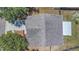 Top-down view of roof with screened-in lanai and fenced yard at 205 Island Water Way, Apollo Beach, FL 33572