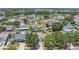 Aerial view showcasing homes in a residential area, featuring pools and fenced backyards at 205 Island Water Way, Apollo Beach, FL 33572