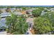 A high-angle view of a residence with tree coverage in a residential neighborhood at 205 Island Water Way, Apollo Beach, FL 33572