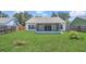 Spacious backyard with a screened-in patio, perfect for outdoor entertaining and relaxation at 205 Island Water Way, Apollo Beach, FL 33572