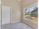 Dining area featuring tile floors, neutral walls, and a bright window offering plenty of natural light at 205 Island Water Way, Apollo Beach, FL 33572