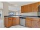 Kitchen featuring stainless steel appliances, wood cabinets, tile floor, and eat-in dining at 205 Island Water Way, Apollo Beach, FL 33572