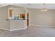 Inviting living area with tile floors, neutral walls, and open access to the kitchen and dining spaces at 205 Island Water Way, Apollo Beach, FL 33572