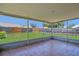 Screened patio with tile floors and a view of the fenced backyard at 205 Island Water Way, Apollo Beach, FL 33572