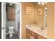 Cozy bathroom with wood vanity, mosaic tile accents, and walk-in shower at 36846 Perry Ct, Dade City, FL 33525