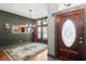 Elegant foyer with hardwood floors, stained glass accents, and a chandelier at 36846 Perry Ct, Dade City, FL 33525