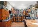 Kitchen with breakfast bar, stainless steel refrigerator, and hardwood flooring at 36846 Perry Ct, Dade City, FL 33525