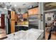 Spacious kitchen with a large granite countertop island and stainless steel refrigerator at 36846 Perry Ct, Dade City, FL 33525