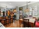 Open concept kitchen and dining area with hardwood floors and decorative lighting at 36846 Perry Ct, Dade City, FL 33525