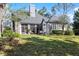 Beautiful rear exterior with stone accents, patio area and well-maintained lawn at 36846 Perry Ct, Dade City, FL 33525