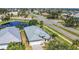 Aerial view of the house showcases its prime location near roads, with its well-maintained roof and landscaping at 6412 Coquina Island Cv, Apollo Beach, FL 33572