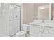 Modern bathroom features a glass-enclosed shower, a toilet, and vanity with storage at 6412 Coquina Island Cv, Apollo Beach, FL 33572