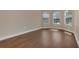 Bright bedroom featuring hardwood floors, ample natural light, and neutral wall paint at 6412 Coquina Island Cv, Apollo Beach, FL 33572