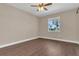Relaxing bedroom featuring hardwood floors, natural light, and neutral paint at 6412 Coquina Island Cv, Apollo Beach, FL 33572