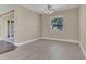Spacious dining area illuminated by a chandelier and natural light from a large window at 6412 Coquina Island Cv, Apollo Beach, FL 33572