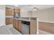Modern kitchen featuring stainless steel appliances, wood cabinets, and open floorplan at 6412 Coquina Island Cv, Apollo Beach, FL 33572