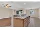 Kitchen featuring granite countertops, stainless steel sink and appliances, open floorplan at 6412 Coquina Island Cv, Apollo Beach, FL 33572
