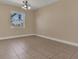 Bright living area with tile floors, natural lighting, and neutral wall paint at 6412 Coquina Island Cv, Apollo Beach, FL 33572