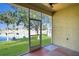 Relaxing screened patio offers a serene view of the lush backyard, and the beautiful lake at 6412 Coquina Island Cv, Apollo Beach, FL 33572