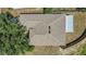Aerial view of the house featuring a well-maintained roof and surrounding greenery at 806 Rocky Mountain Ct, Valrico, FL 33594