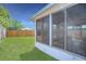 Lush green backyard with a fenced perimeter and an enclosed sunroom attached to the home at 806 Rocky Mountain Ct, Valrico, FL 33594