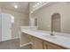 A well-lit bathroom features a vanity with dual sinks, a large mirror, and ample space for your daily routine at 806 Rocky Mountain Ct, Valrico, FL 33594
