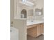 Bright bathroom featuring a single sink vanity with wood cabinets and neutral wall color at 806 Rocky Mountain Ct, Valrico, FL 33594