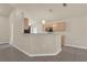 An open kitchen features bar seating, pendant lighting, and ample cabinet space for storage and convenience at 806 Rocky Mountain Ct, Valrico, FL 33594