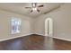 The living room features hardwood floors, a ceiling fan, and a view of the screened-in lanai at 806 Rocky Mountain Ct, Valrico, FL 33594