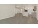 Expansive living area with tile flooring throughout and neutral walls, providing versatile layout options at 806 Rocky Mountain Ct, Valrico, FL 33594